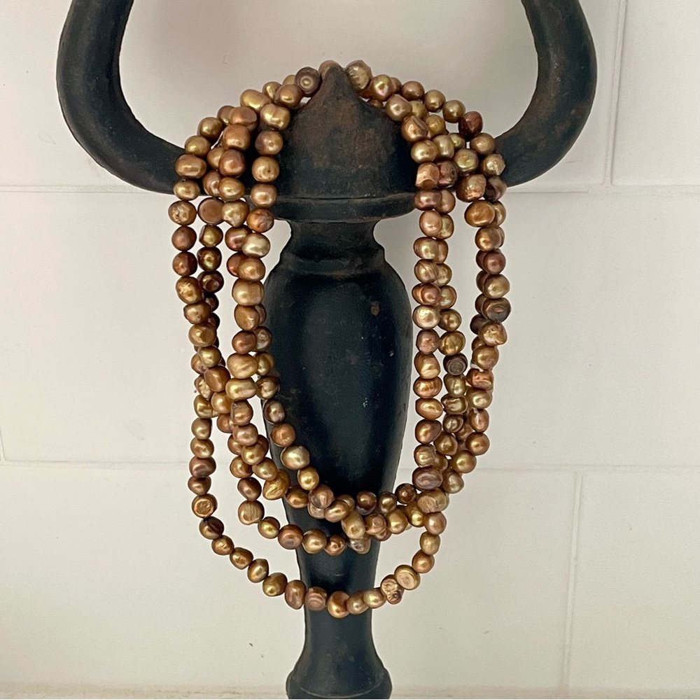 Gorgeous Long Strand of Fresh Water Pearls in Gold Tones. Approximately 28”Long